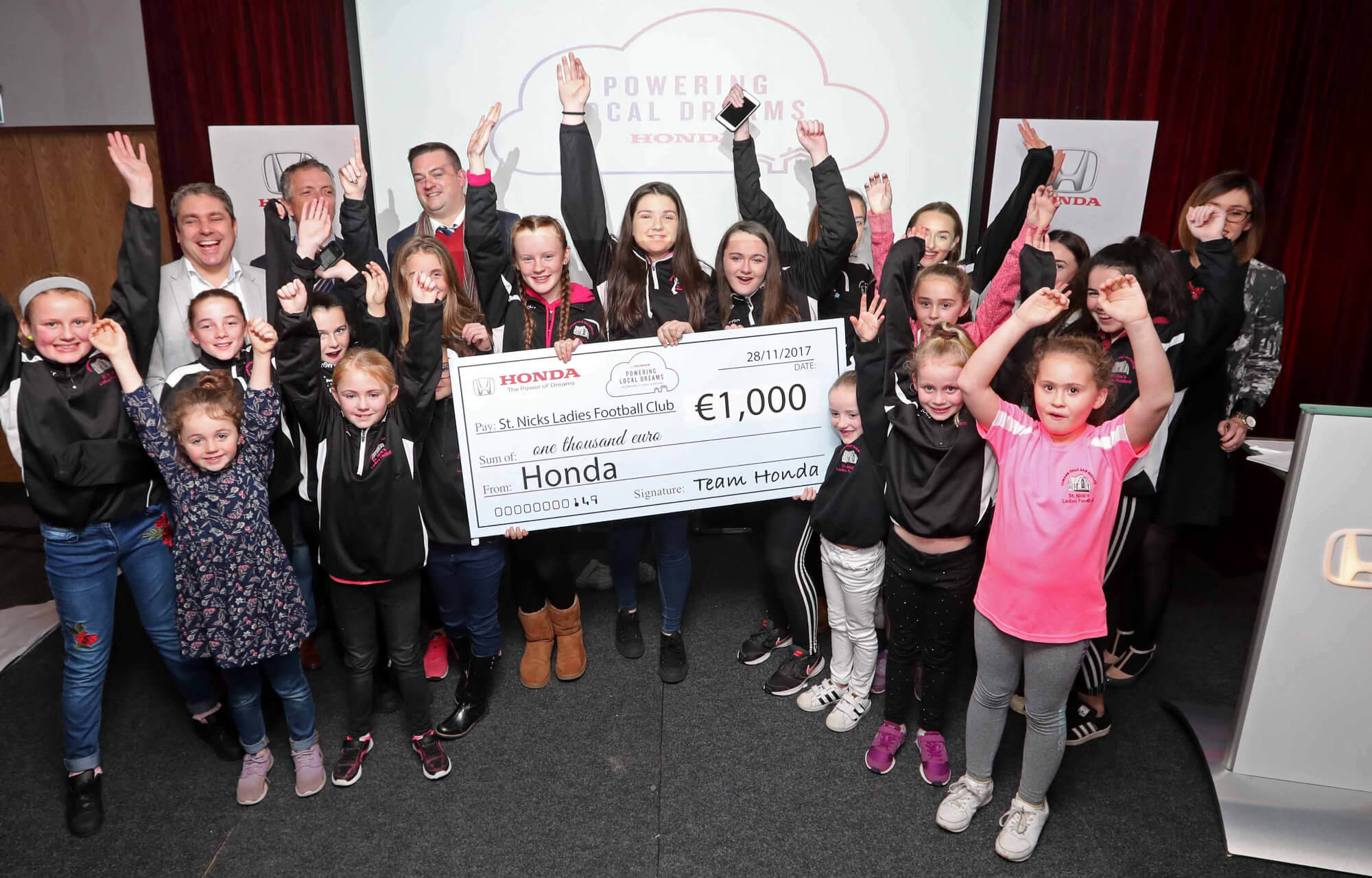 St. Nicks Ladies Football Club receiving €1,000 cheque from Honda Ireland